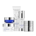 Anti-Aging Program skincare set with cleanser, polish, renewal pads, defense serum, and growth factor serum in travel and full sizes