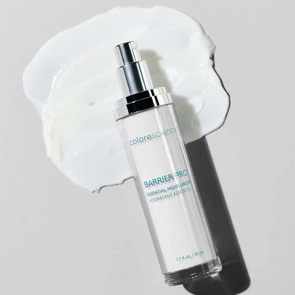 Colorescience Barrier Pro Essential Moisturizer pump bottle on a white background with a smear of white cream.