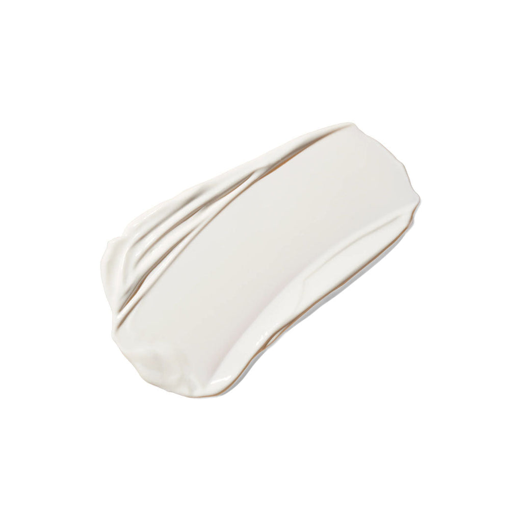 A smooth, creamy white swatch of lightweight, untinted mineral body sunscreen on a plain white background.
