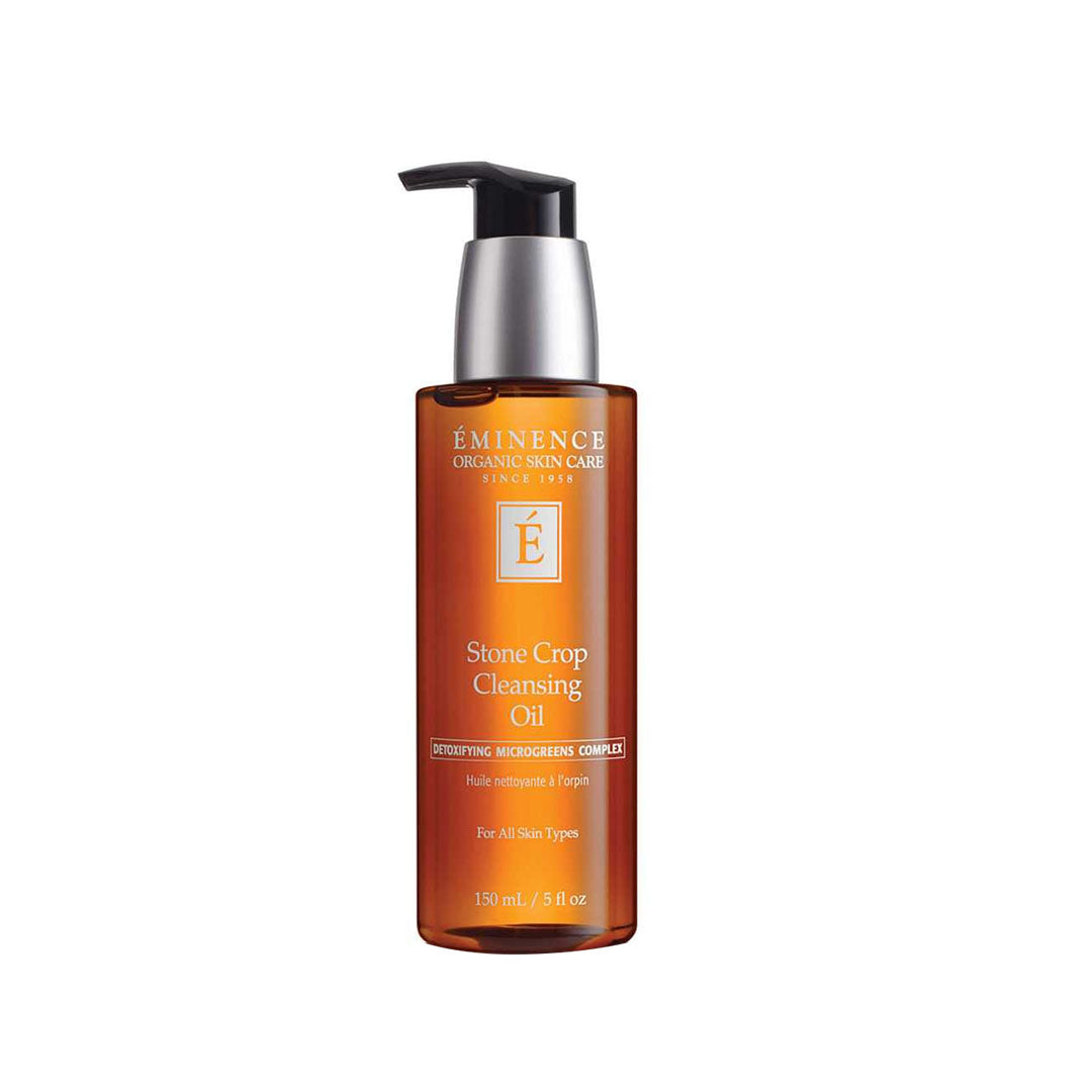 Amber 150ml pump bottle of Eminence Stone Crop Cleansing Oil with white label and black dispenser top.