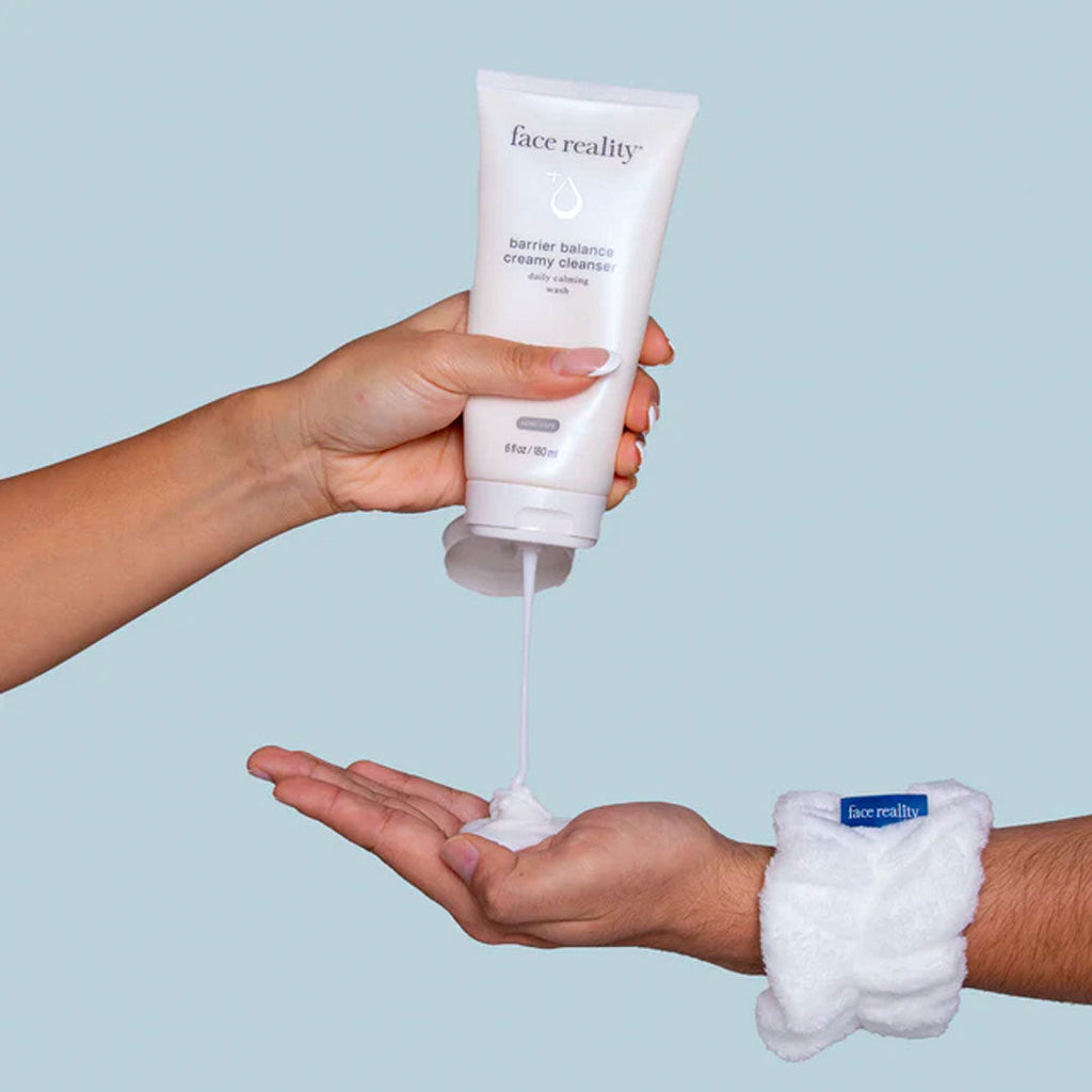 hand squirting Barrier Balance Creamy Cleanser by Face Reality into palm