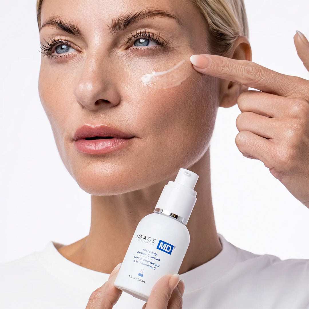Restoring Power-C Serum bottle with updated formula and airless pump packaging for enhanced vitamin C stability and anti-aging benefits
