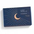 Dark blue Osmosis Lunar Travel Kit box with a copper crescent moon and sunburst design.