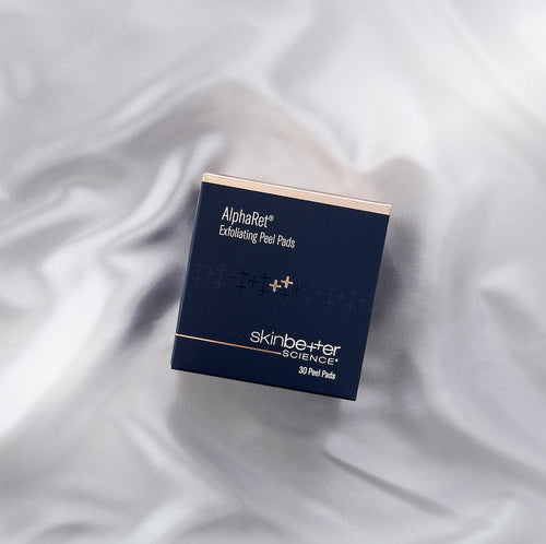 Alpharet Exfoliating Peel Pads box on silk background