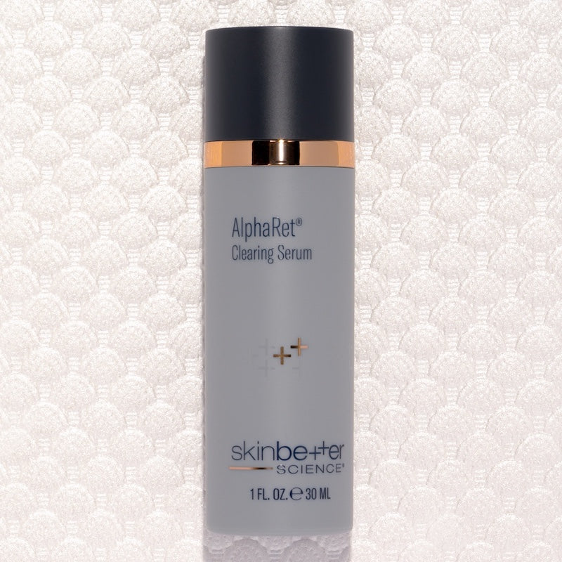 skinbetter alpharet clearing serum on textured white background