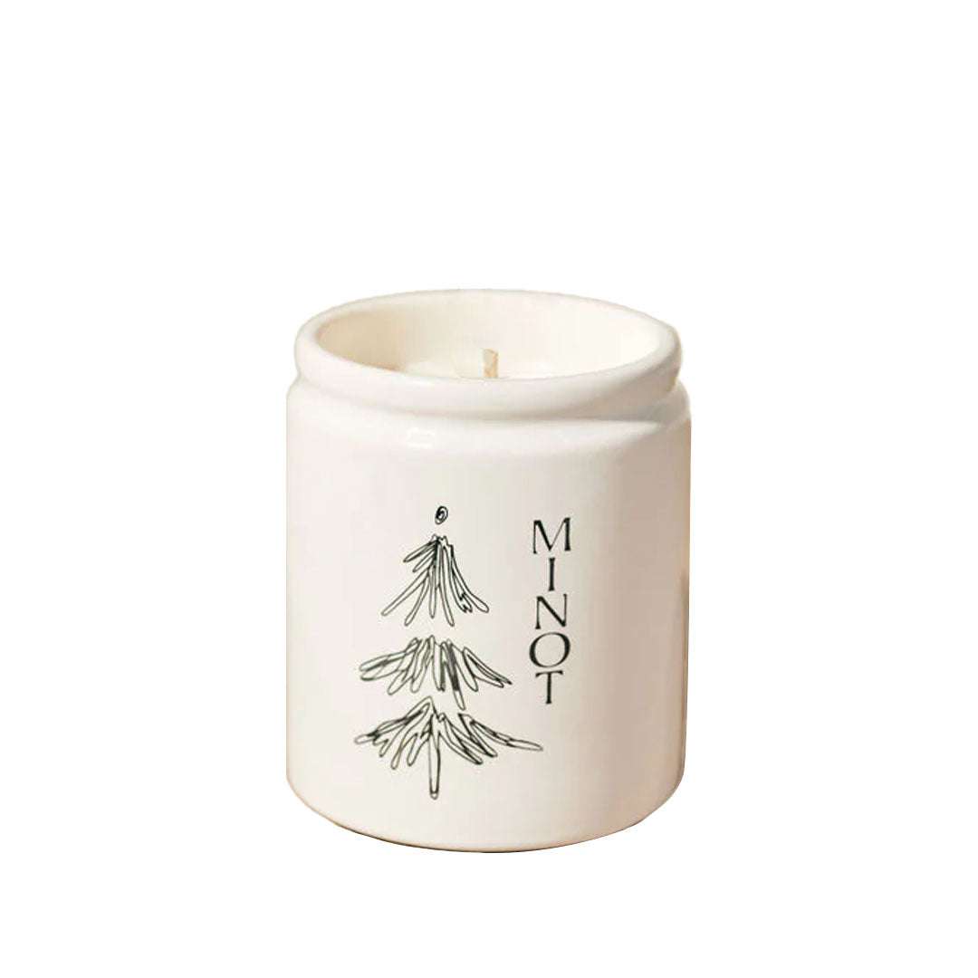 Under The Tree Candle with pine, fir, cedarwood, and clove scent in a 7 oz soy wax jar with gold lid